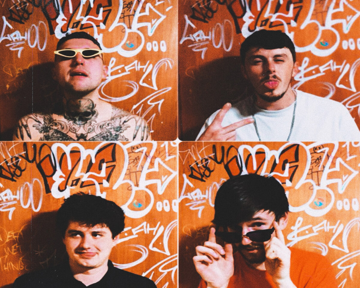 a grid of four photos featuring men posing against an orange wall covered with white graffiti. In the top left, a person with visible neck and chest tattoos is wearing small white sunglasses. The top right shows someone making a face and hand gesture wearing a white shirt. The bottom left shows a person with dark hair giving a slight smile. The bottom right features someone wearing sunglasses and pointing with their finger, wearing what appears to be an orange shirt that matches the background. The photos have a vintage film quality with slightly warm colouring, and appear to be taken in the same session against the consistent graffiti backdrop.
